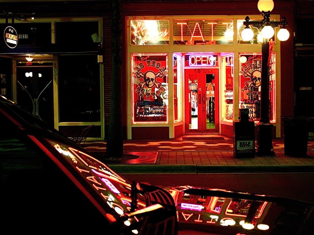 Las Vegas Tattoo Co. neon storefront at night in Ybor City