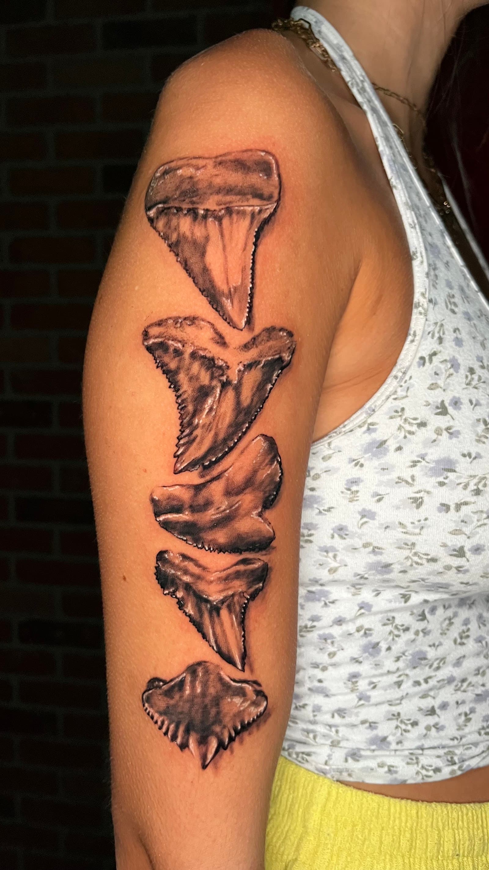 Realistic shark teeth arm tattoo