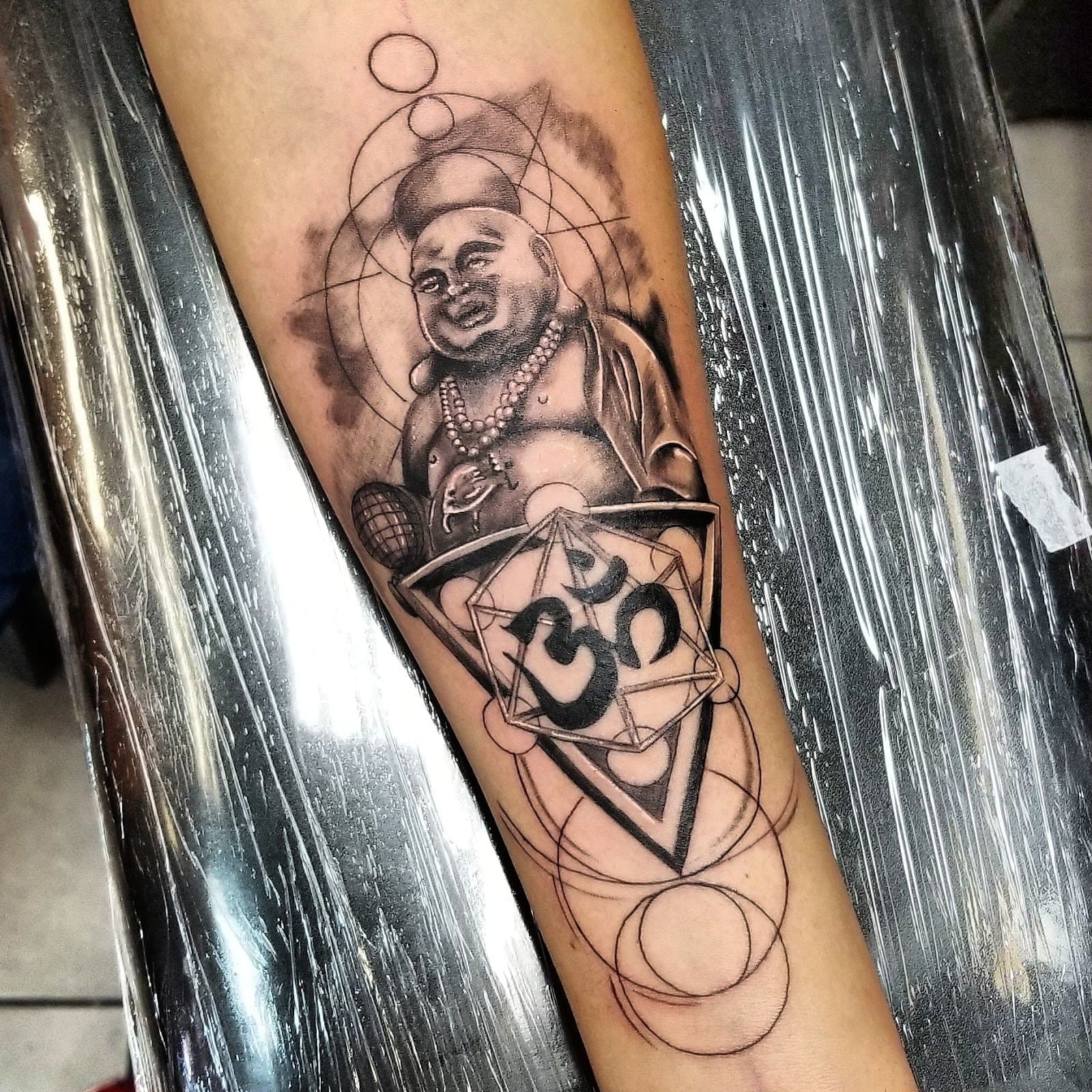 Buddha and sacred geometry forearm piece