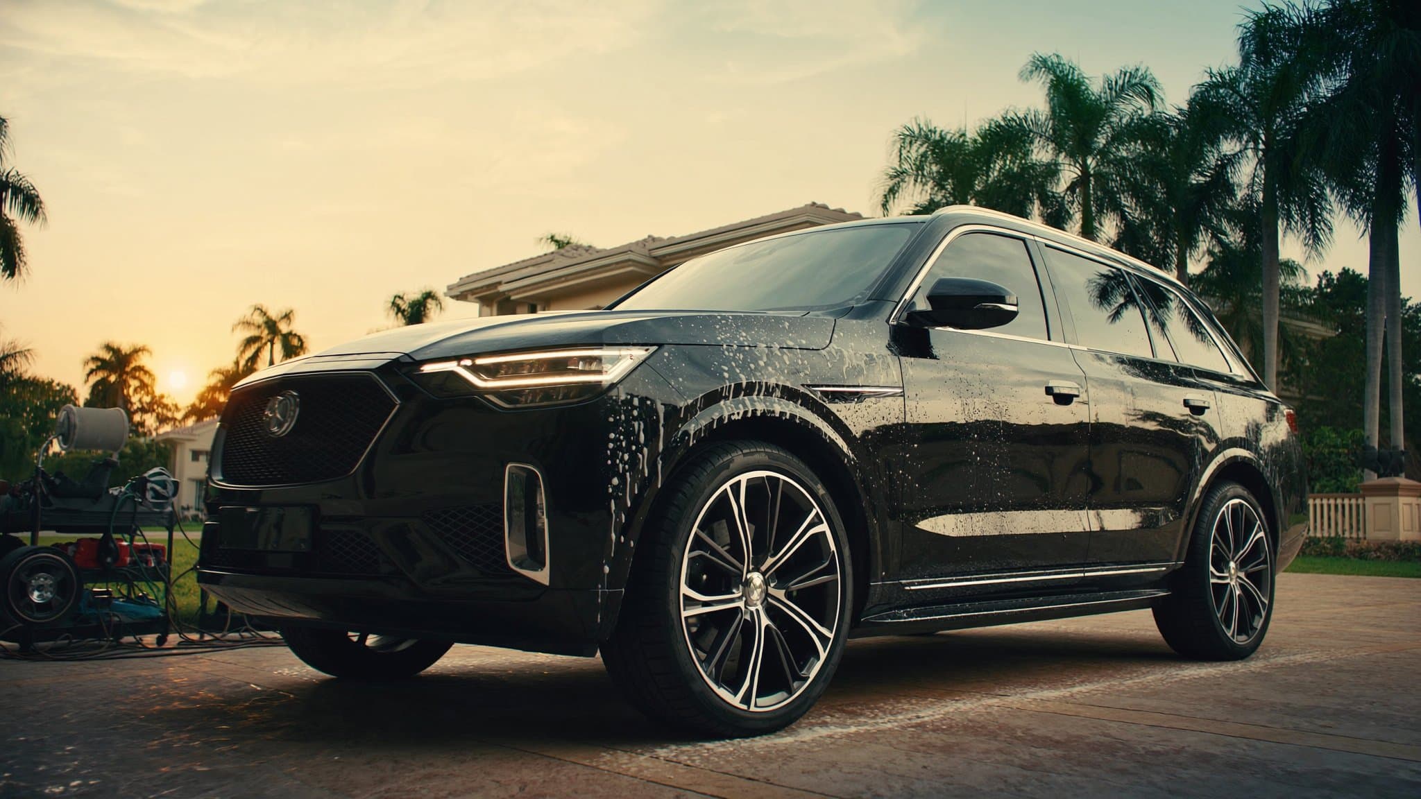 Freshly detailed black SUV at golden hour in a Tampa driveway