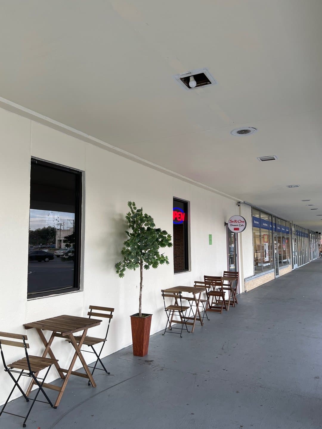 K Dessert Cafe plaza storefront and patio seating