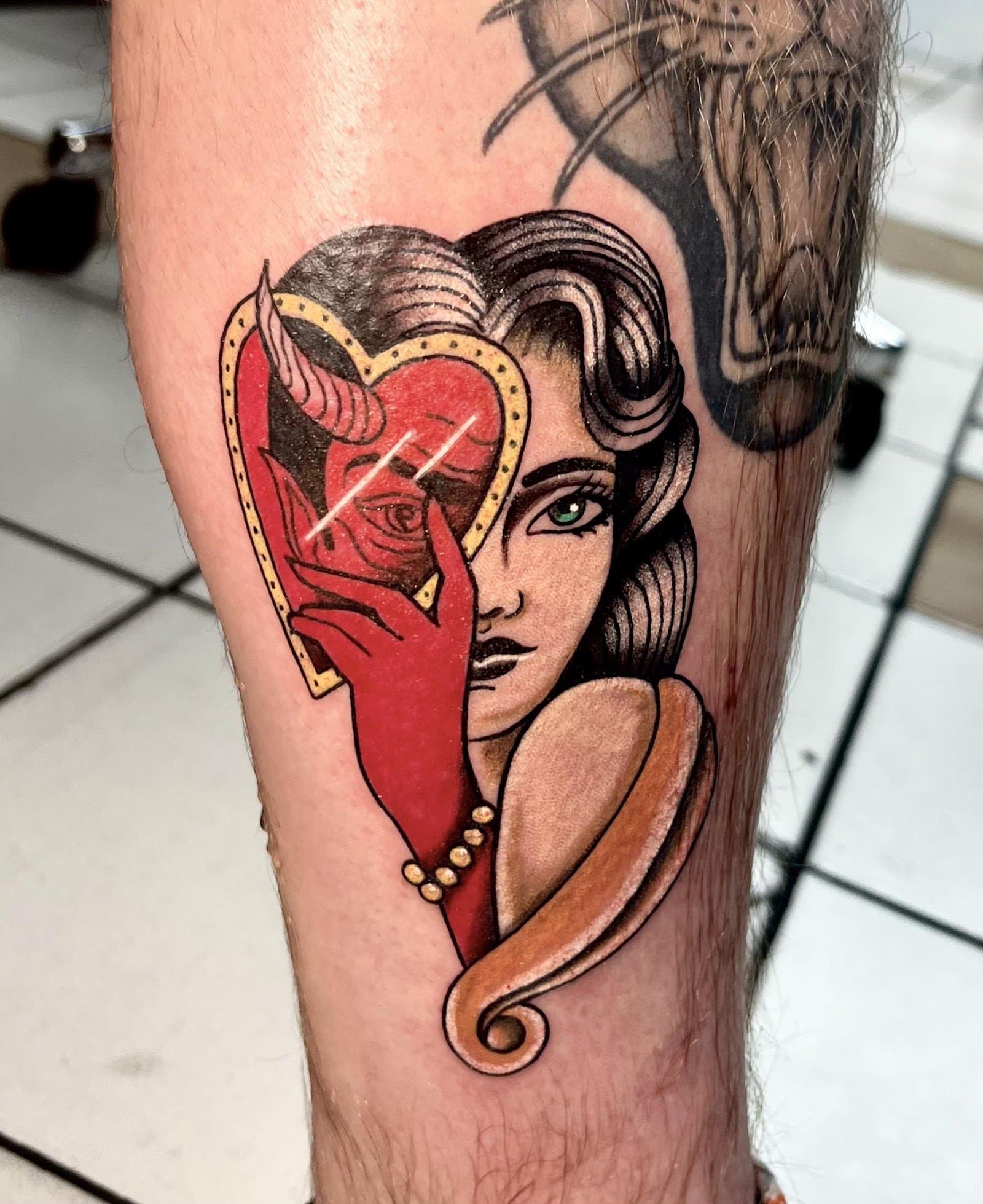 Neo-traditional color tattoo of a woman with devil hand
