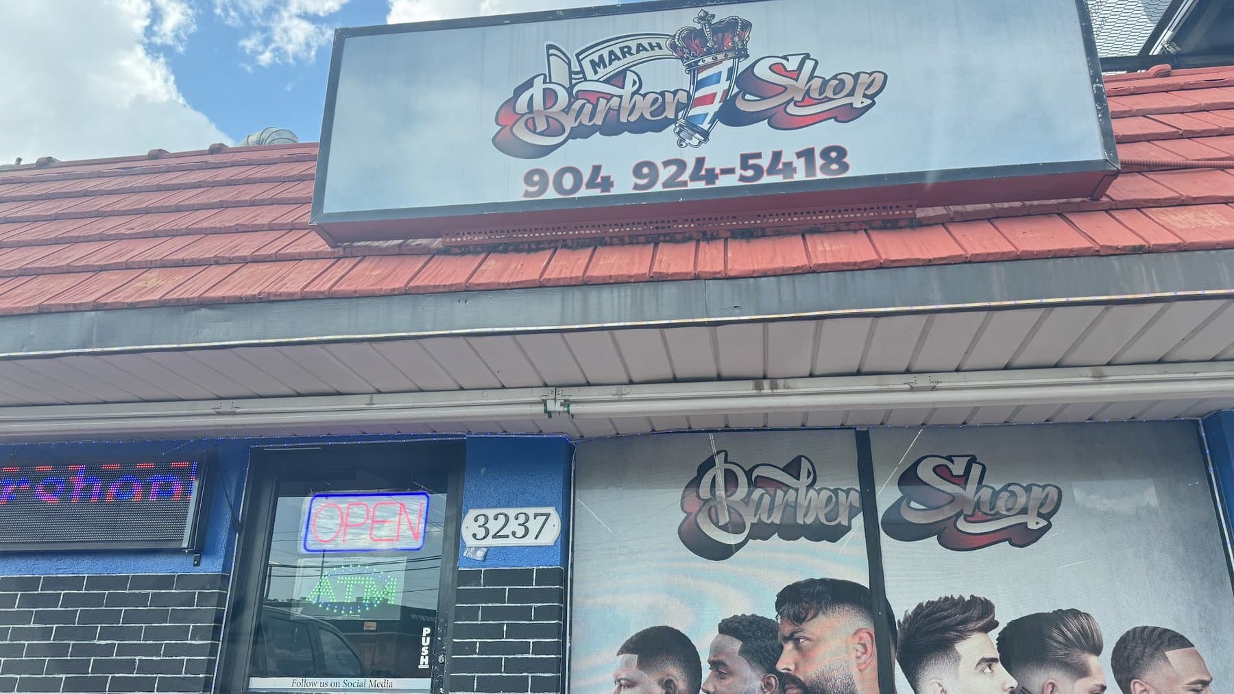 The Marah Barber Shop storefront and sign on W Columbus Dr in Tampa