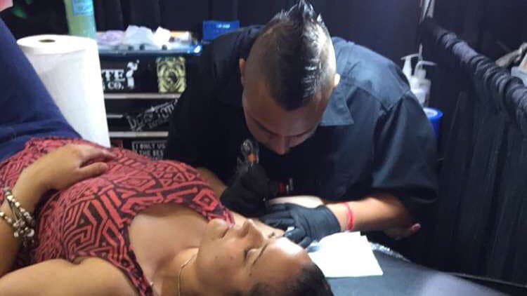 Tattoo session in progress