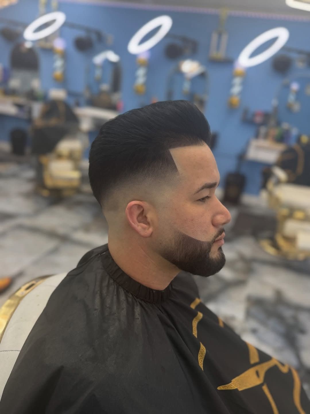 Pompadour skin fade with sculpted beard at Tonikon Barbershop
