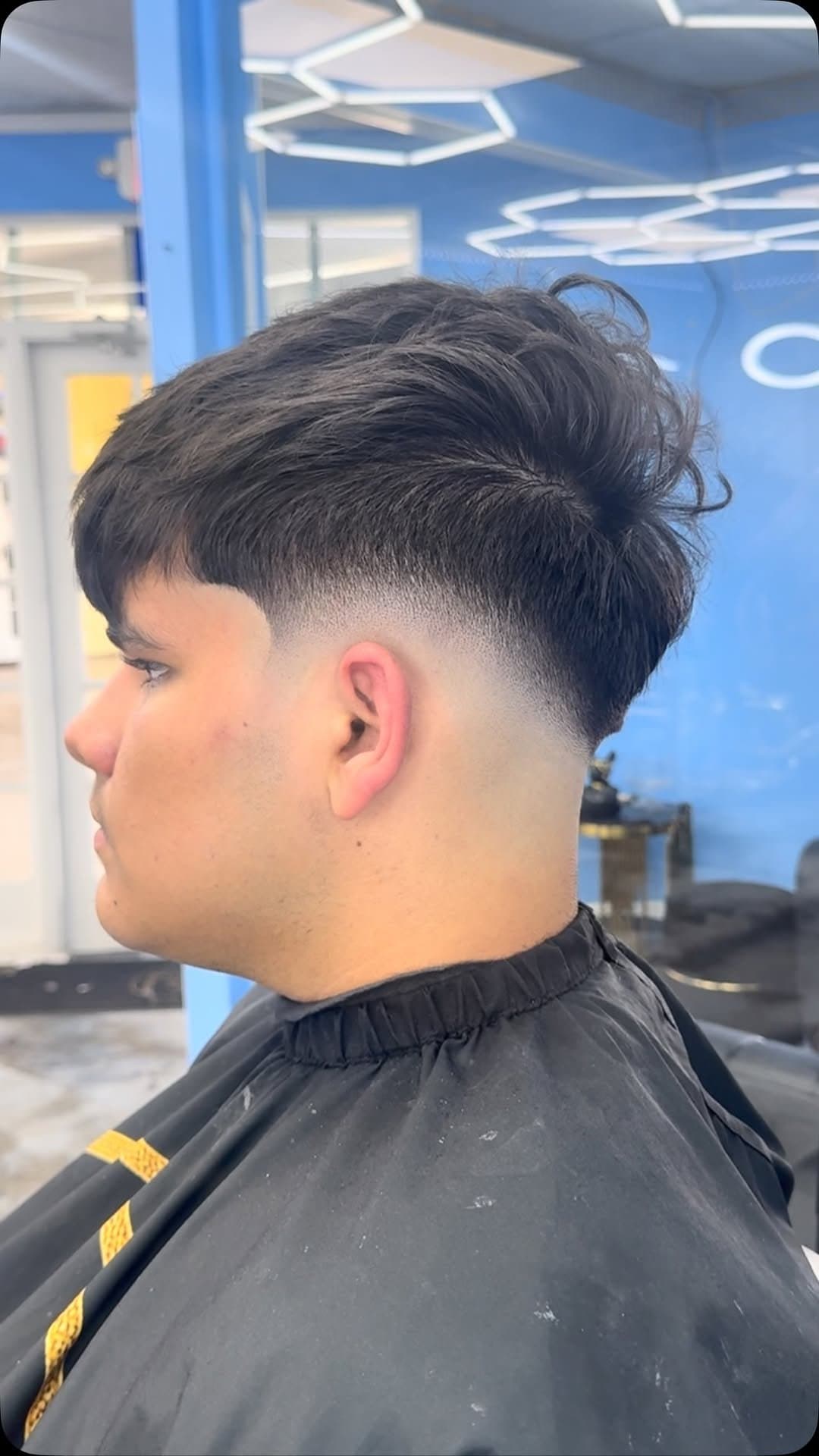 Low taper fade with textured top, fresh from the chair
